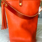 O Ring Bucket Bag in Mandarin Vachetta