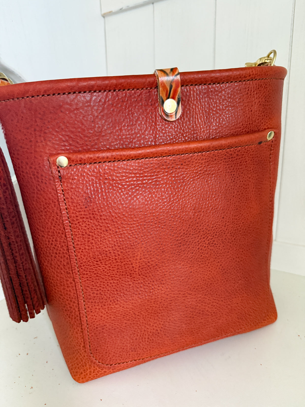 Bennett Bucket in Brick Bison Full Grain Leather w/Candy Strap