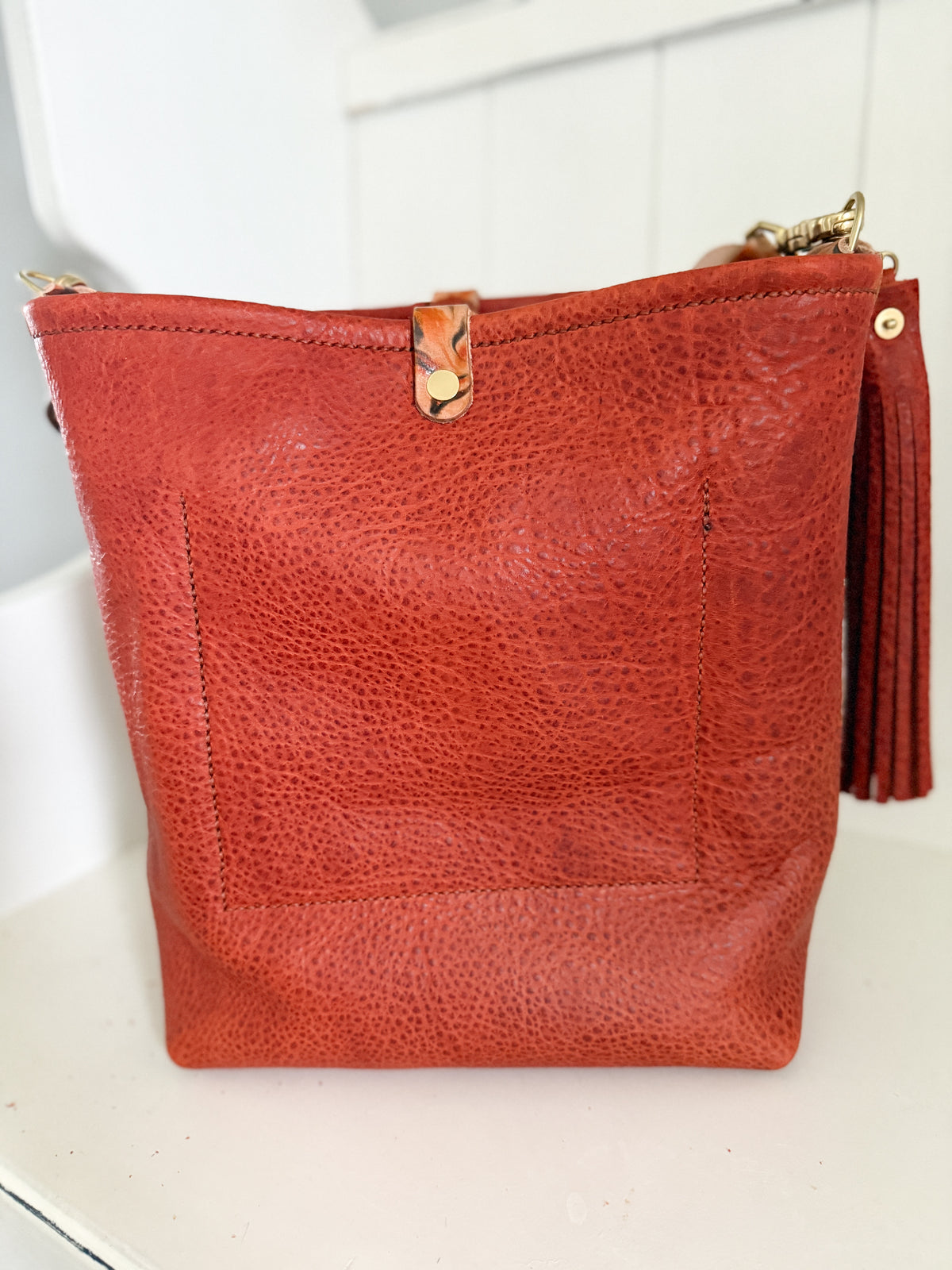 Bennett Bucket in Brick Bison Full Grain Leather w/Candy Strap