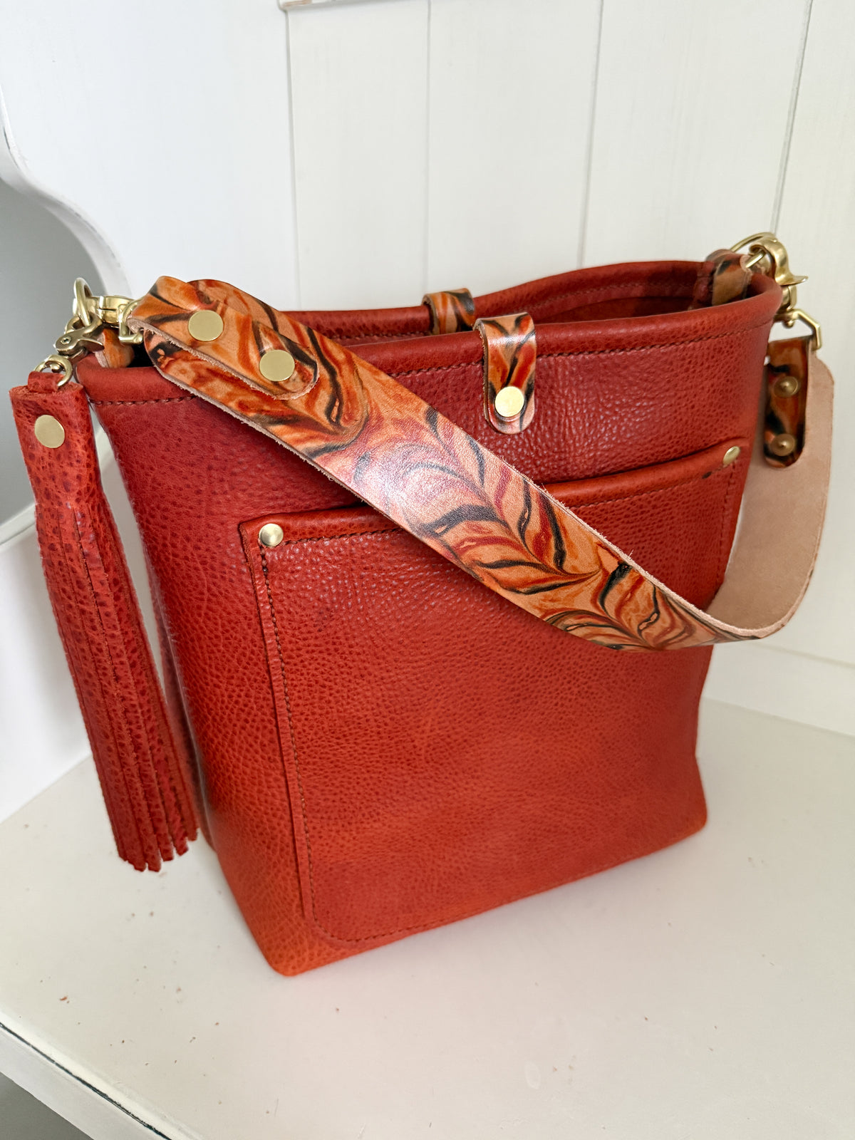 Bennett Bucket in Brick Bison Full Grain Leather w/Candy Strap