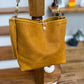 Hobo Bucket in Goldenrod Full Grain Bison w/Candy Strap