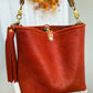 Hobo Bucket in Brick Full Grain Bison w/Candy Strap