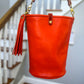 O Ring Bucket Bag in Mandarin Vachetta