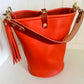 O Ring Bucket Bag in Mandarin Vachetta