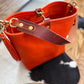 Hobo Bucket in Mandarin Vachetta