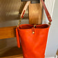 O Ring Bucket Bag in Mandarin Vachetta