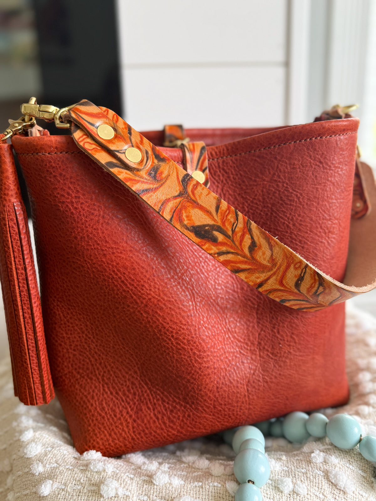Hobo Bucket in Brick Full Grain Bison w/Candy Strap