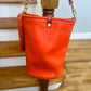 O Ring Bucket Bag in Mandarin Vachetta