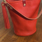 O Ring Bucket Bag in Mandarin Vachetta